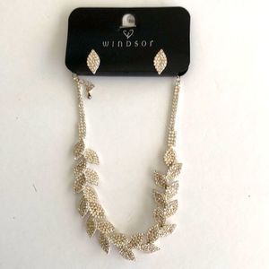 Rhinestone leaf design silver color with matching earrings brand new